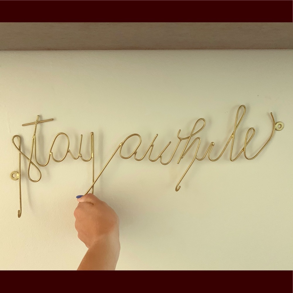 Urban Outfitters ‘Stay Awhile’ sign